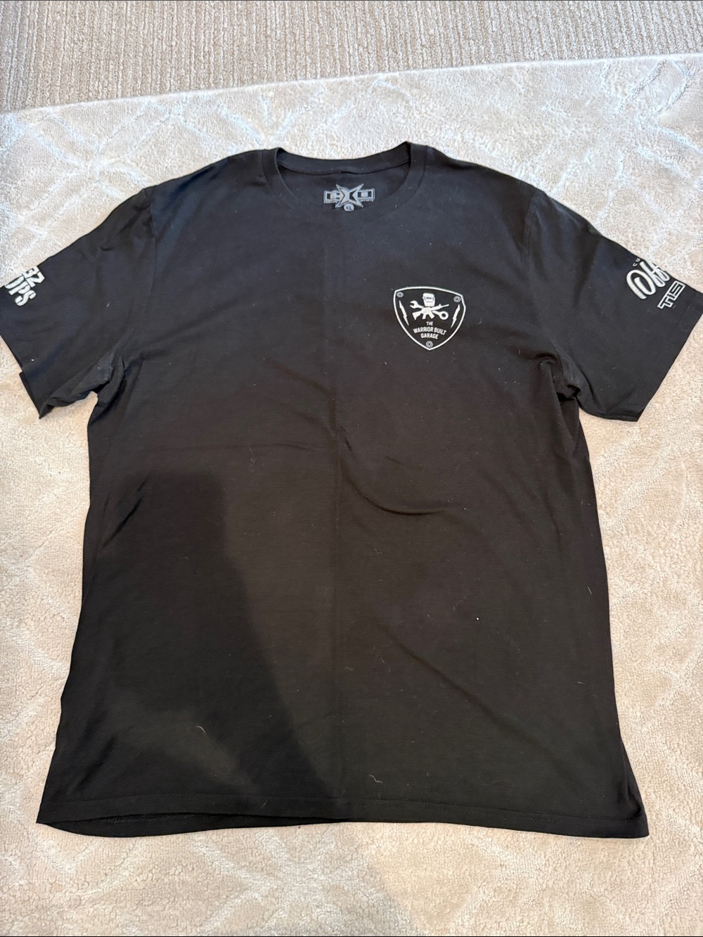 Men's Black Short-Sleeve Graphic Tee with Chest Shield Emblem